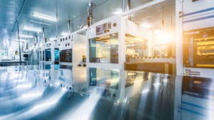 Interior of Bio-Pharmaceutical Facility with machines reflecting on metal