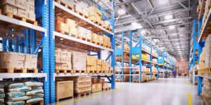 Warehouse with variety of materials stored on tall blue shelves